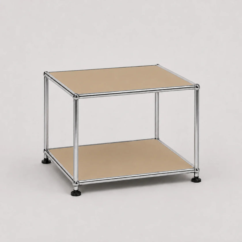 A two-tier modular storage shelf with a chrome metal frame, beige metal-covered shelves, and black caster feet, shown on a light gray background.