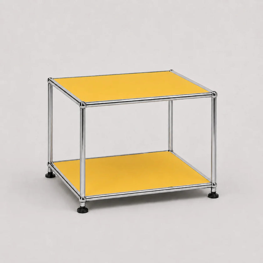 A two-tier modular side table featuring a chrome steel frame and yellow shelves, set against a neutral light gray background.