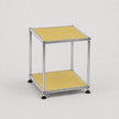 A modern two-tier modular side table with a chrome metal frame and goose yellow panels on a light gray background.