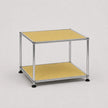 A modern two-tier modular storage cart with a chrome metal frame and goose yellow panels on a light gray background.