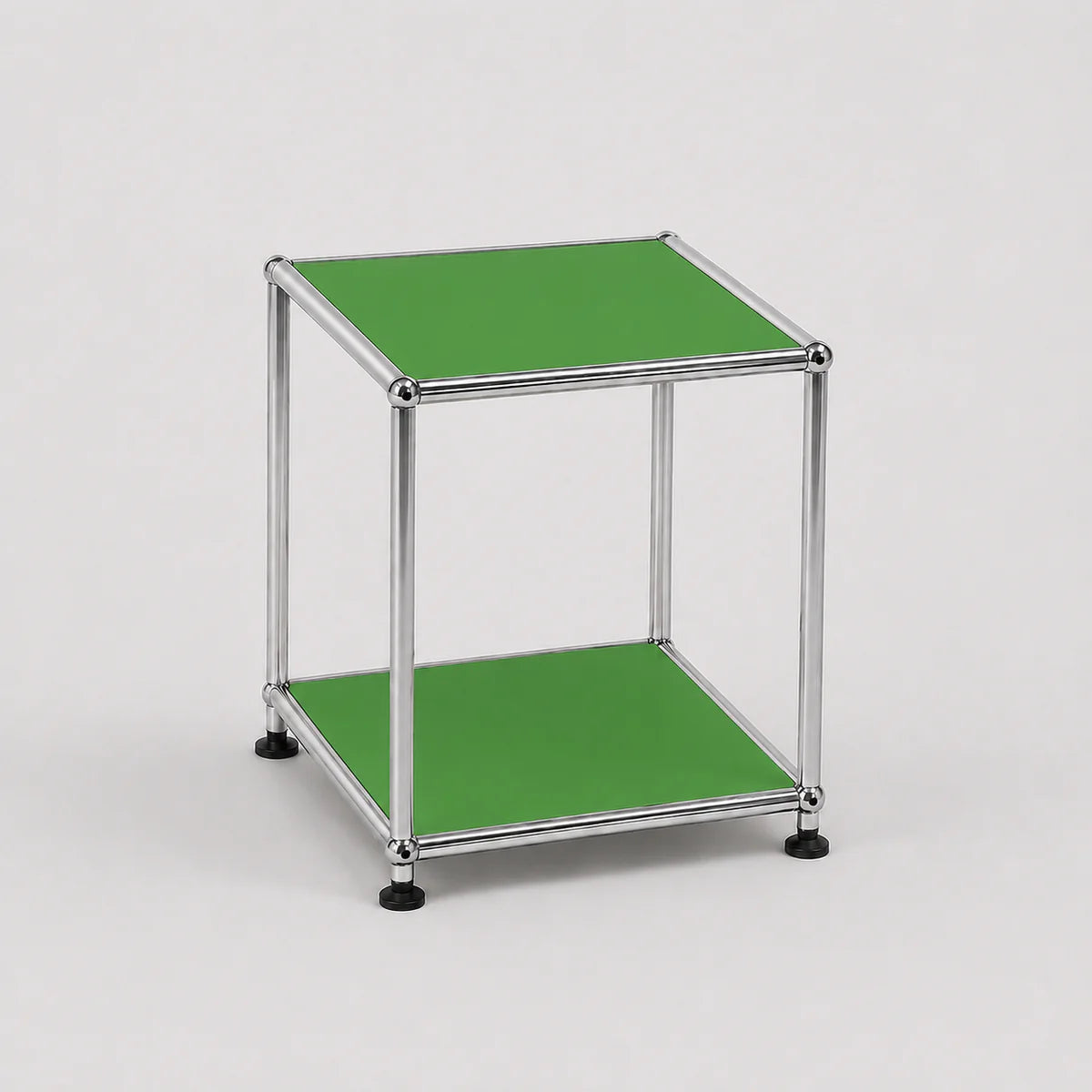 A modern two-tier side table with a chrome silver metal frame and bright green panels on the top and bottom shelves, set against a plain light gray background.