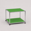 A two-tier modular storage shelf or side table with a chrome metal frame and green panels on a light gray background.