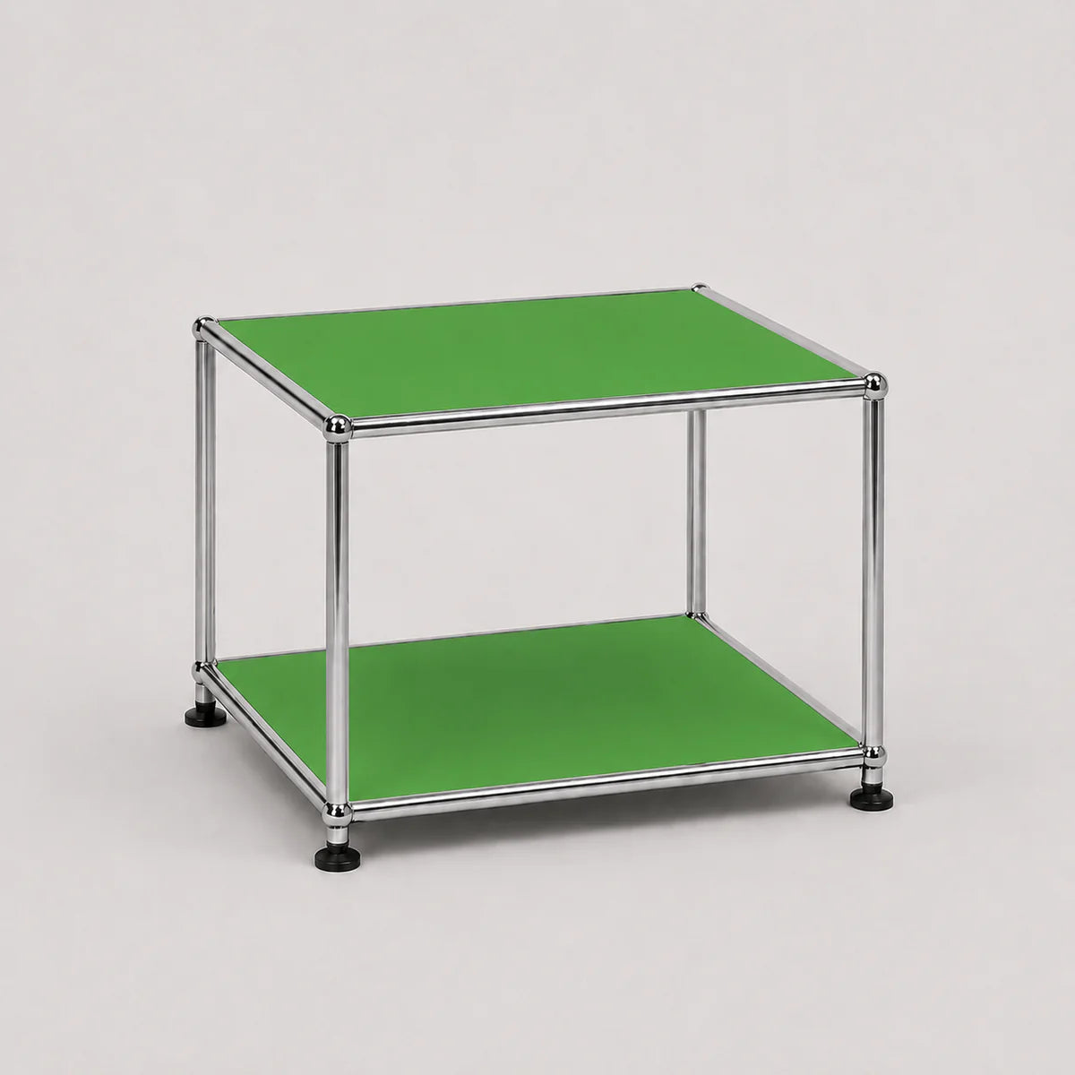 A two-tier modular storage shelf or side table with a chrome metal frame and green panels on a light gray background.