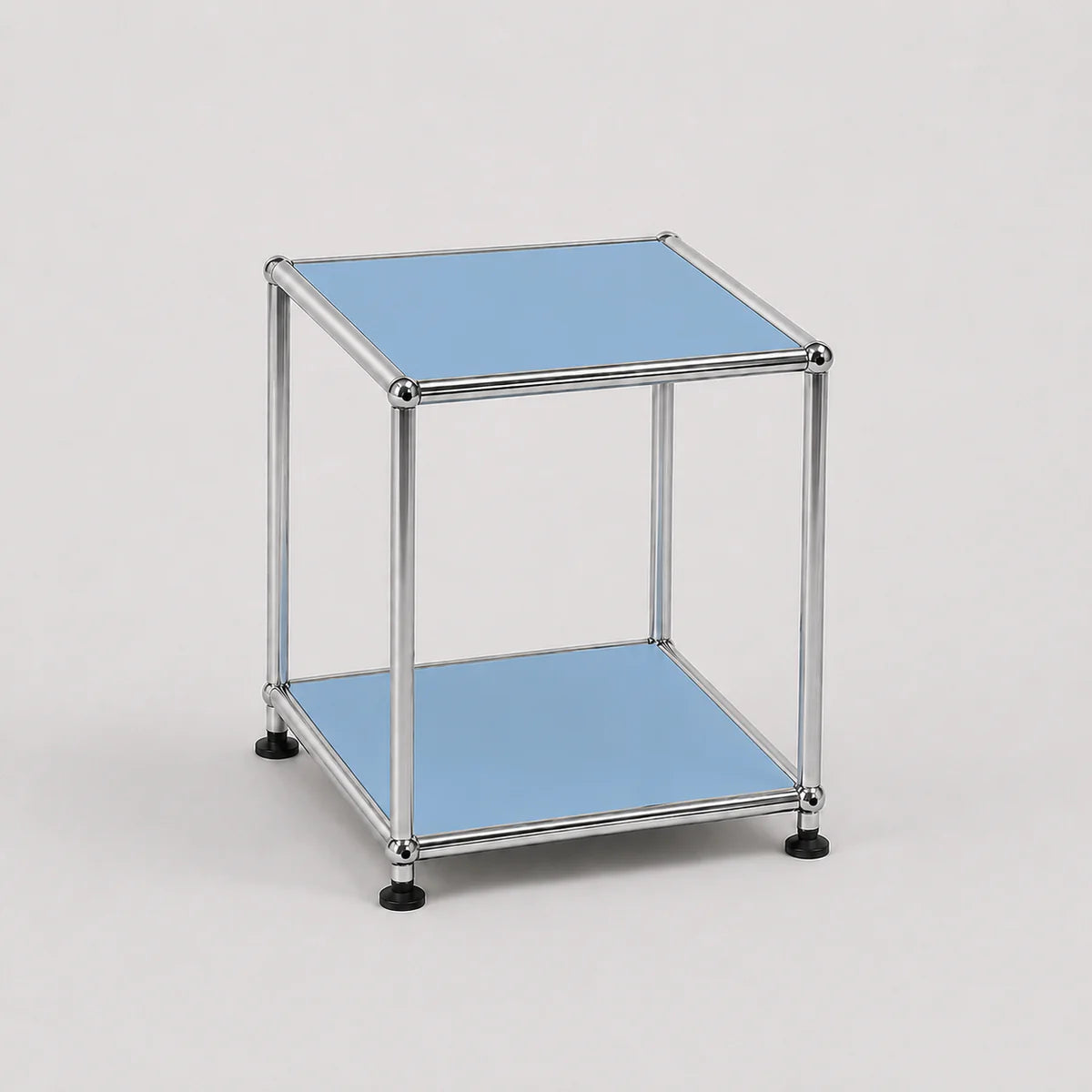 A modern two-tier modular side table with a chrome metal frame and light blue panel shelves, shown on a neutral light gray background.