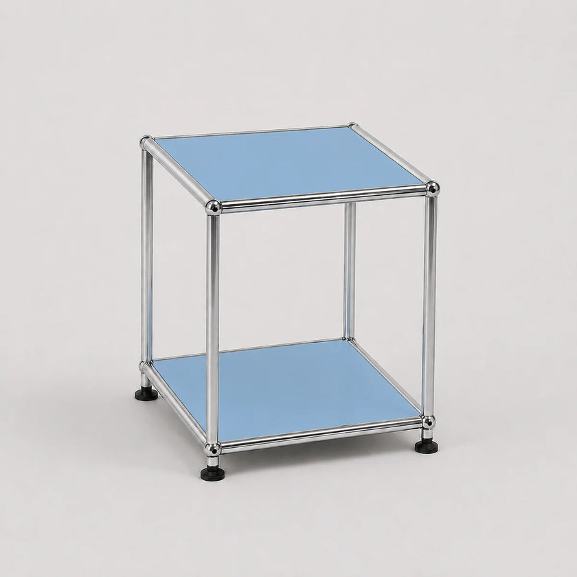 A modern two-tier modular side table with a chrome metal frame and light blue panel shelves, shown on a neutral light gray background.
