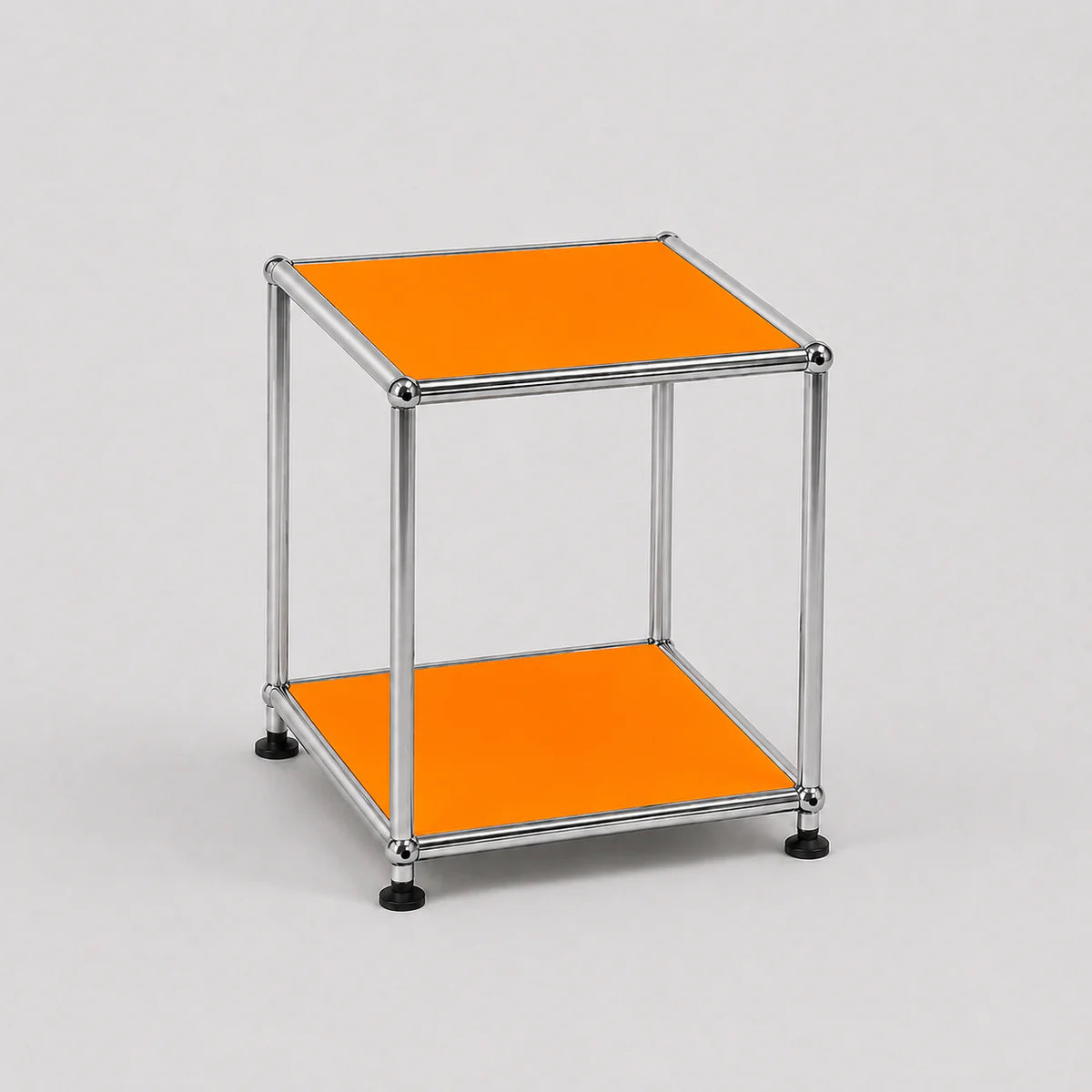 A modern two-tier modular side table with a chrome metal frame and orange panels on a light gray background.