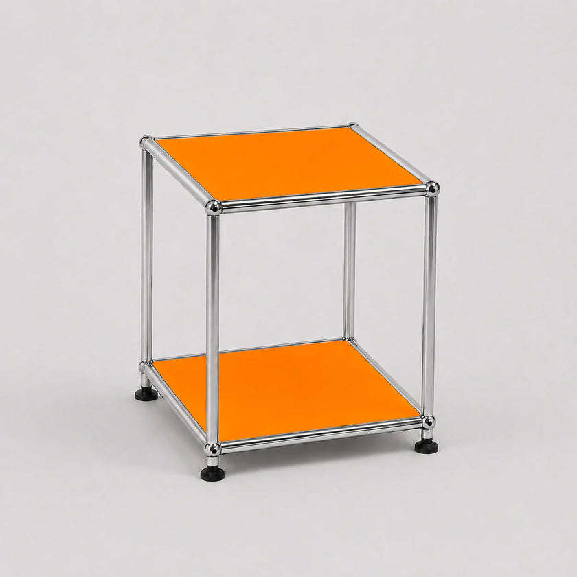 A modern two-tier modular side table with a chrome metal frame and orange panels on a light gray background.