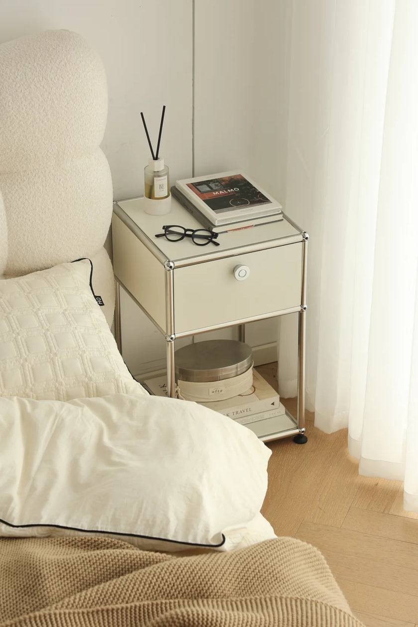 Bedroom scene with a inspired recreation USM modular nightstand next to a bed