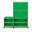 A modular storage cabinet with bright green panels and a silver metal frame, featuring two upper doors with round silver knobs and four lower open shelves, set against a plain white background.