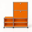 An orange modular storage cabinet with a chrome metal frame and black feet, featuring two upper doors with silver knobs and four lower open shelves, shown on a white background.
