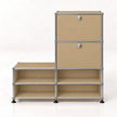 A modular storage organizer with a chrome metal frame and beige fabric panels, featuring two upper drawers with round silver knobs and four lower open shelves, set against a plain white background.