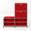 A red modular storage cabinet with a chrome metal frame, featuring two upper doors with round silver knobs and four open shelves below, set against a plain white background.