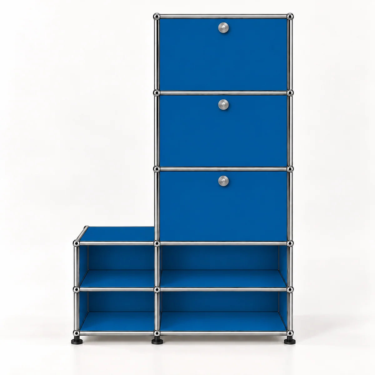 Blue modular storage cabinet with three drawers on the right side of a taller unit and four open shelves on the bottom, featuring silver metal framing and round silver knobs.