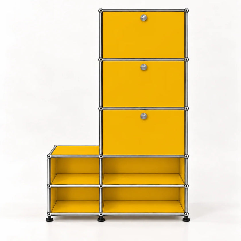 A modular storage cabinet with a bright yellow finish, featuring three drawers on the upper right with round silver knobs and four open shelves on the lower, all mounted on a chrome metal frame with black feet, set against a plain white background.