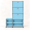A modular storage cabinet with light blue panels and a chrome metal frame, featuring three drawers on the top right with round silver knobs and four open shelves on the bottom.