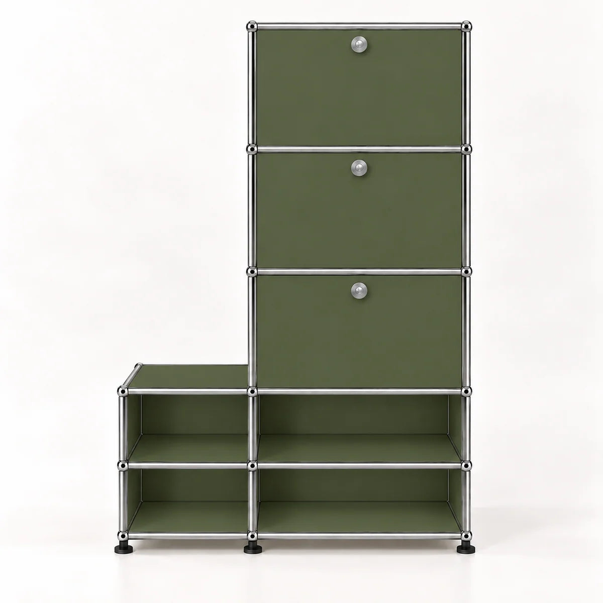A modular storage organizer with olive green metal panels and a chrome metal frame, featuring three drawers with round silver knobs on the top section and open shelves on the bottom, set against a plain white background.