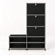 A modular black storage cabinet with a silver metal frame, featuring three drawers on the upper right with round silver knobs and four open shelves on the lower, set against a plain white background.