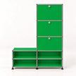A green modular storage cabinet with three drawers on the right and four open shelves, connected by a silver metal frame with round knobs.