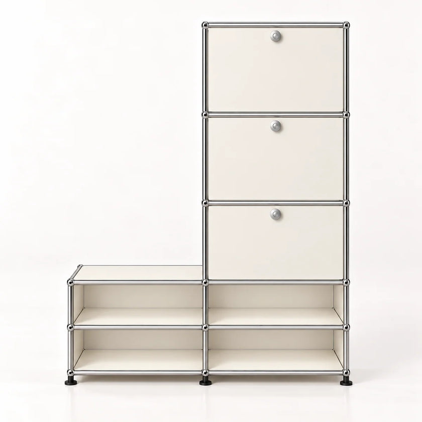 A modular storage cabinet with a chrome-finished metal frame, featuring three cream-colored drawers on the right with round silver knobs, and four open shelves, set against a plain white background.
