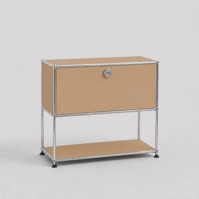 A modern modular two-tier storage cabinet with a silver chrome wire frame, tan canvas panels, and a silver round lock on the upper drawer front, set against a neutral light gray background.