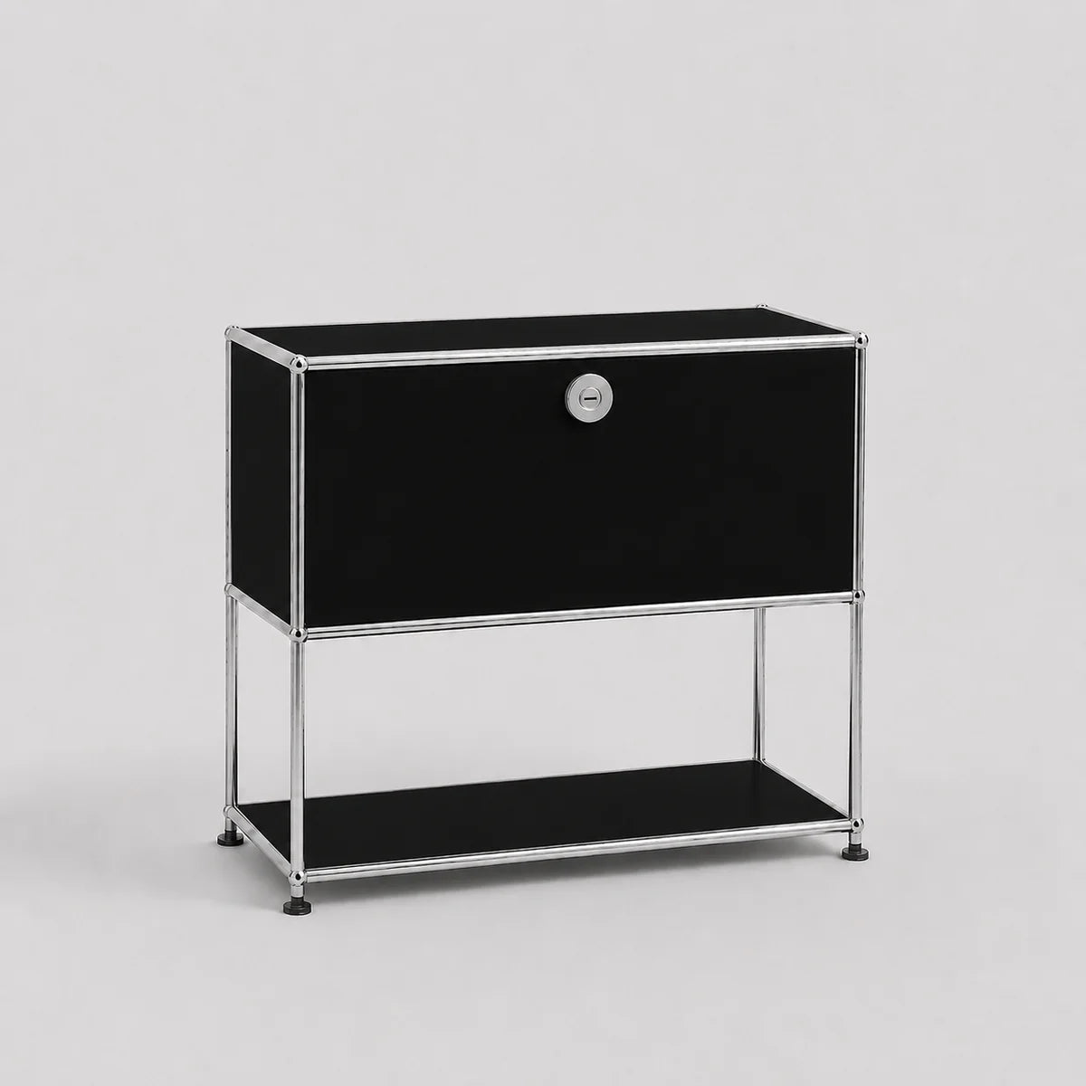 Black modular storage cabinet with metal frame on a light gray background