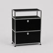 A modern black and chrome modular two-drawer storage cabinet with an open top shelf, shown on a light gray background.