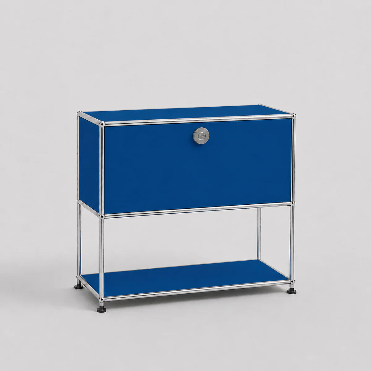 A modern modular two-tier storage cabinet with a bright blue enamel finish and a chrome-plated tubular steel frame, featuring a lock on the upper door.