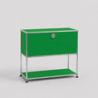 A modern modular two-tier storage cabinet with a vibrant green finish and a chrome metal frame, featuring a lock on the upper door and a lower shelf.