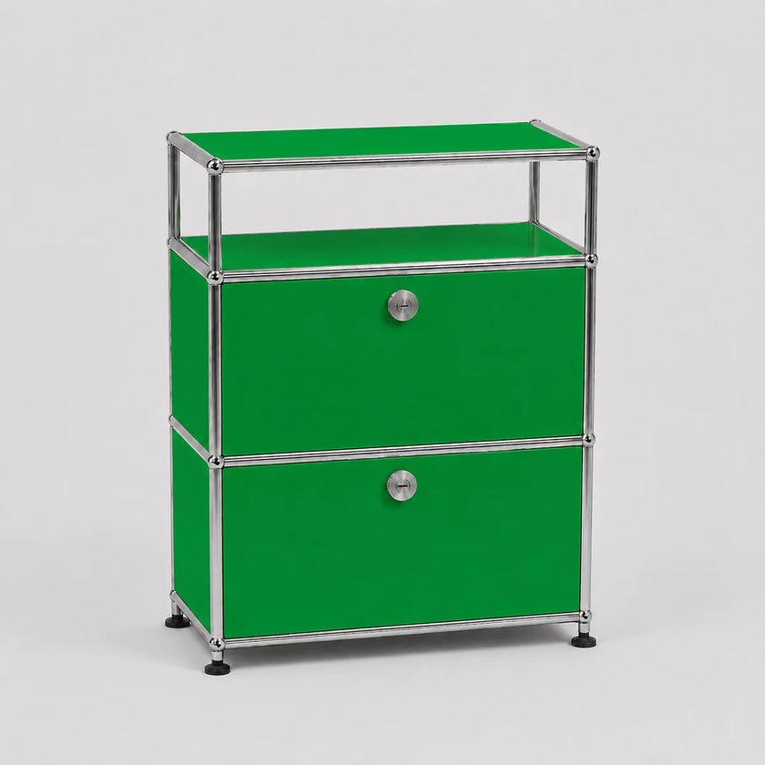A green two-drawer modular storage cabinet with a chrome metal frame and round silver knobs, set against a light gray background.