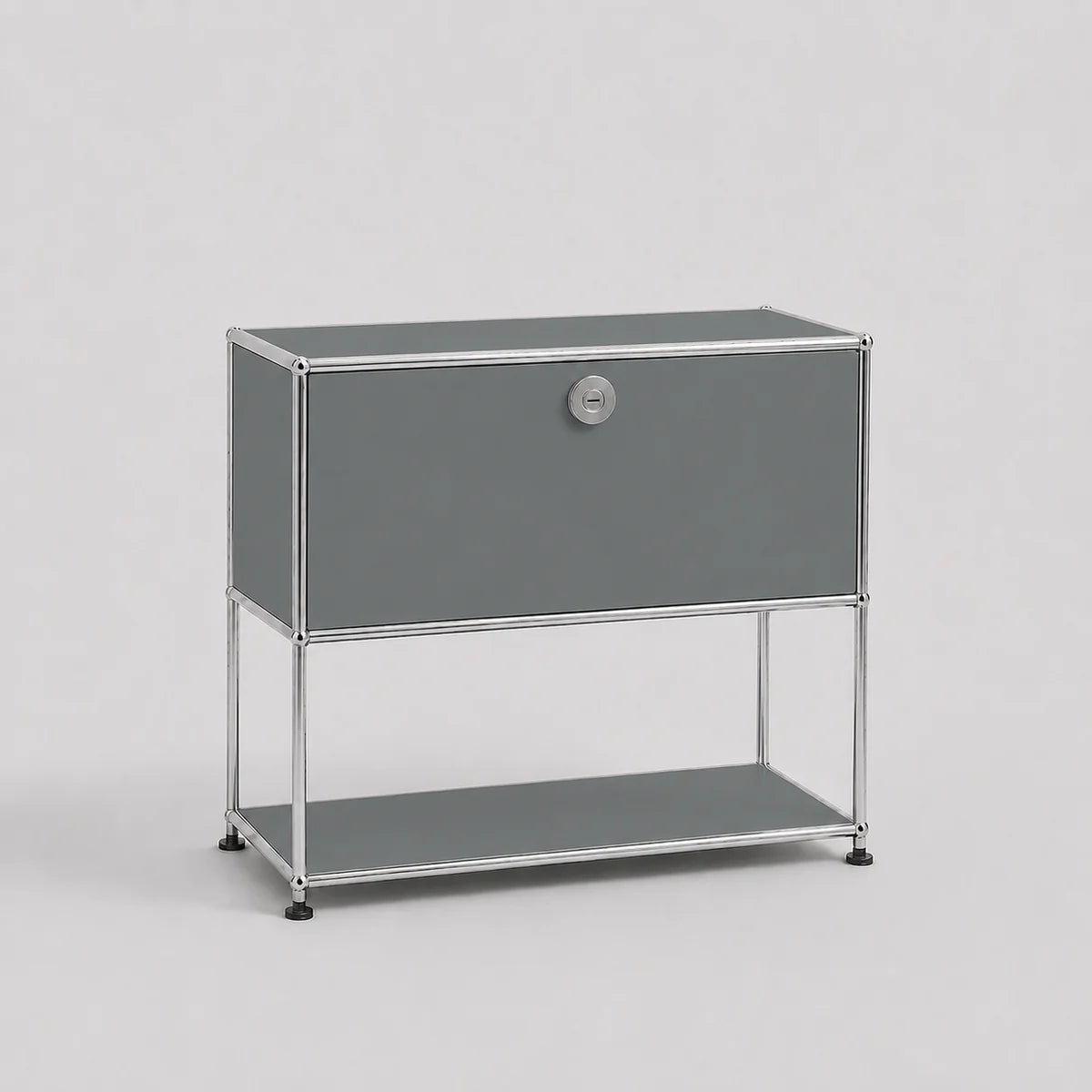 A modern gray modular storage cabinet with a single lockable door and an open lower shelf, supported by a slim chrome metal frame, shown against a light gray background.