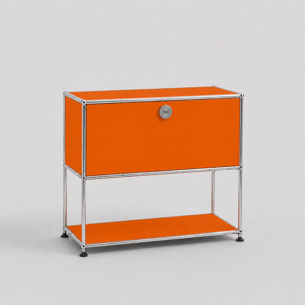 An orange modular storage cabinet with a silver metal frame, featuring a single lockable door with a round silver handle and an open lower shelf, set against a light gray background.