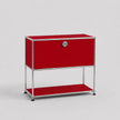 A modern modular two-tier storage cabinet with a vibrant red fabric-covered frame and a chrome metal tubular frame, featuring a lock on the upper compartment door.