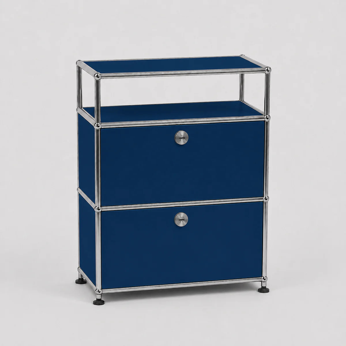 A modern modular two-drawer storage cabinet with a deep blue fabric finish and a chrome metal frame, featuring round silver knobs and black feet, set against a light gray background.