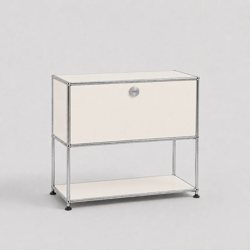 A modern modular two-tier nightstand with a chrome wire frame and cream-colored panels, featuring a single drawer on the top tier and an open shelf on the bottom, set against a plain light gray background.