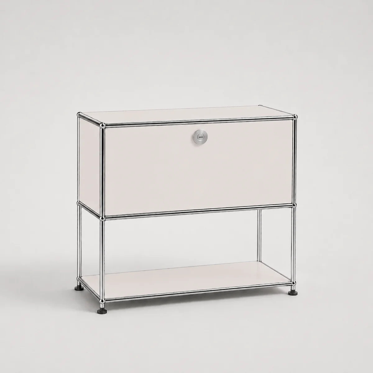 A modern two-tier storage cabinet with a white front panel, a silver metal frame, and a small round silver knob on the upper drawer front, set against a light gray studio background.