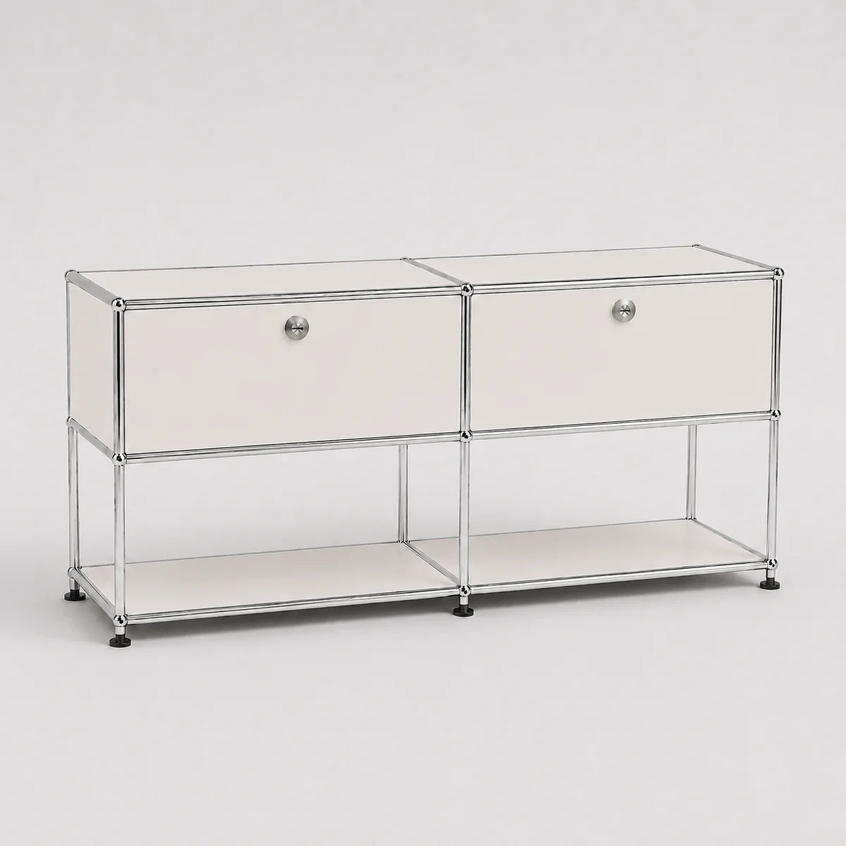 A modern two-drawer storage cabinet with a chrome wire frame, white drawer fronts, round silver knobs, and a lower open shelf, photographed on a light gray studio background.