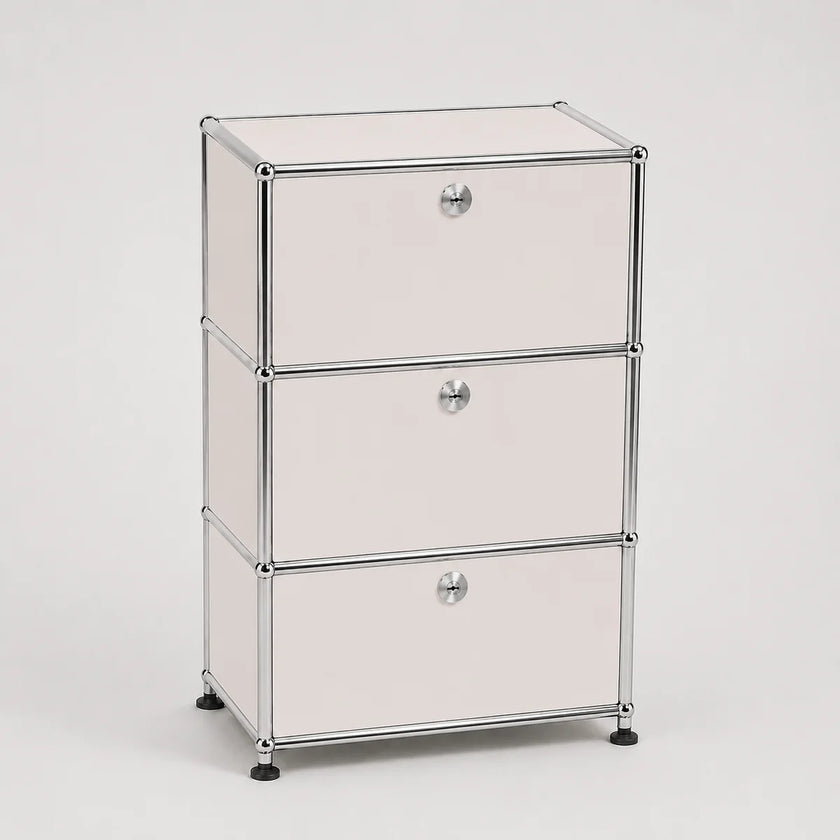 Three-drawer storage cabinet with white metal doors and a chrome metal frame, shown on a light gray background.
