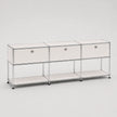 A modern modular storage cabinet with three drawers and two open shelves, featuring a chrome wire frame and frosted off-white panels, set against a plain light gray background.