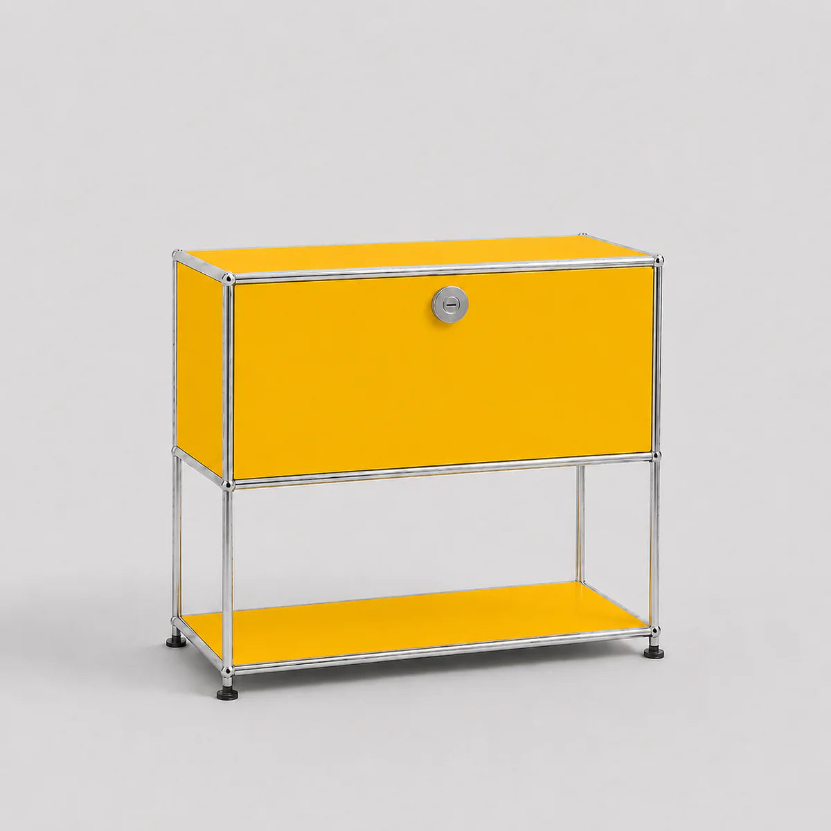 A modern modular two-tier storage cabinet with a bright yellow finish and a chrome metal frame, featuring a lock on the upper drawer front.