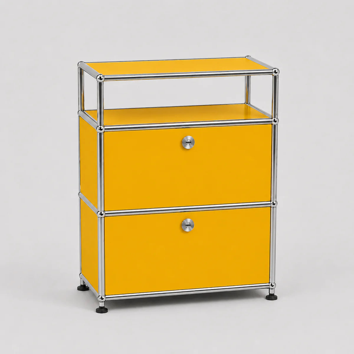 A modern two-drawer modular storage cabinet with a bright yellow enamel finish and a chrome tubular metal frame, featuring small round silver knobs and black caster wheels.