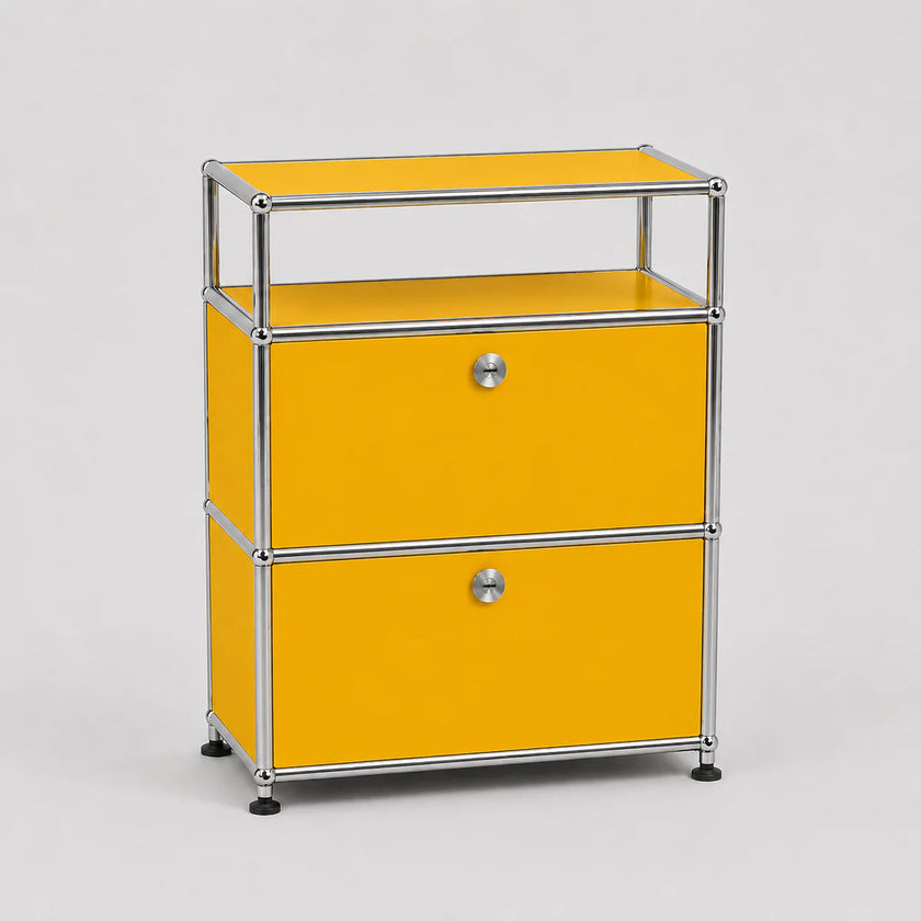 A modern two-drawer modular storage cabinet with a bright yellow enamel finish and a chrome tubular metal frame, featuring small round silver knobs and black caster wheels.