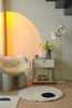 Modern interior with a chair, replica USM modular side table, and floor lamp.