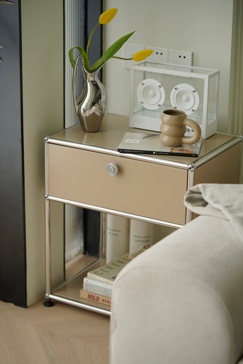 Beige inspired recreation USM modular side table with a vase, mug, and books in a room setting