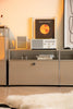 Modern interior with a replica USM modular tv stand displaying a record player and album cover.