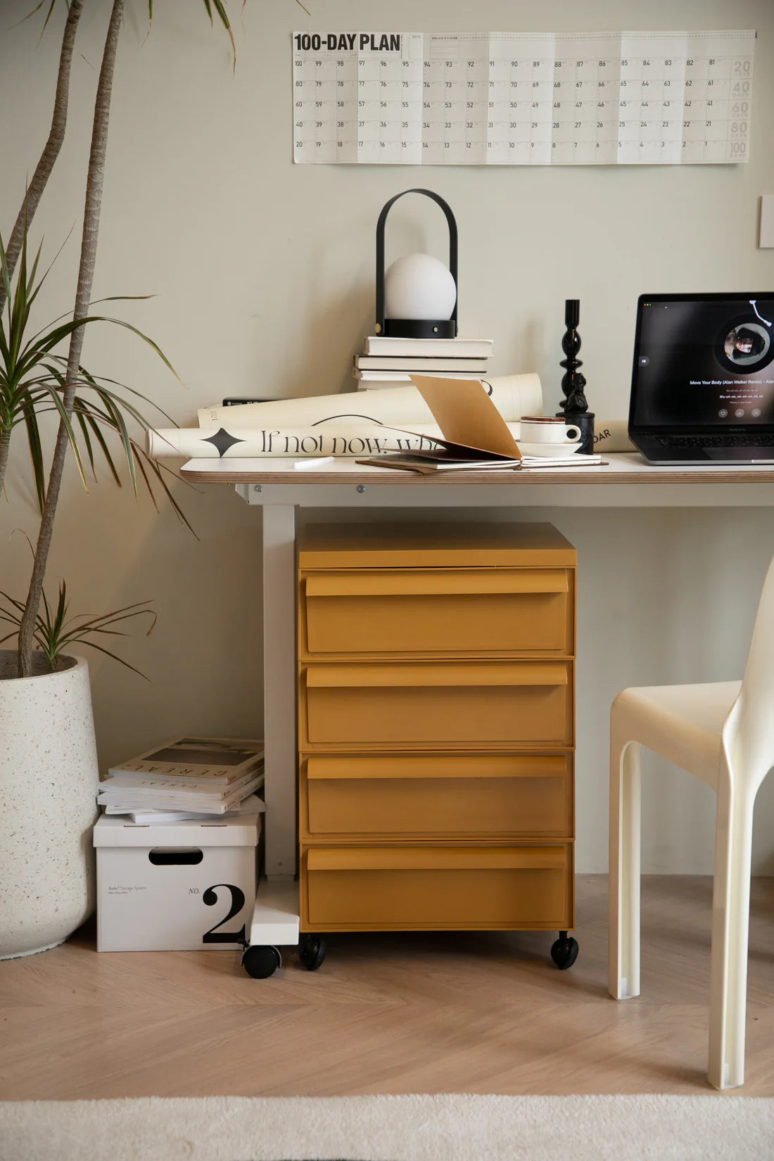 Home office with a desk, filing cabinet, and decor items.