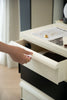 Lady opening a 3 tier rolling cart, drawer with jewelry on a dresser