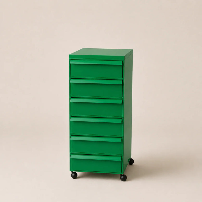 Green abs plastic filing cabinet on a beige background
