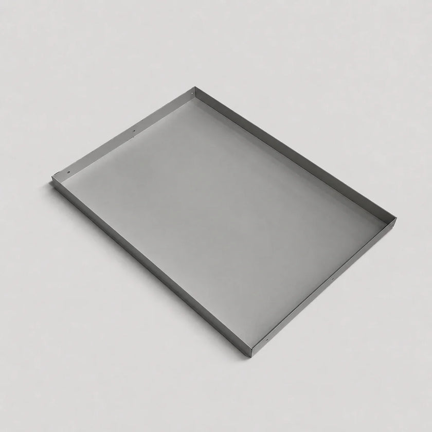A minimalist rectangular metal tray with a thin silver frame, shown at an angle on a light gray background.