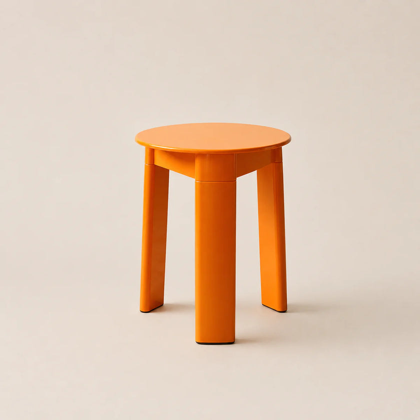 Orange stool on a beige background