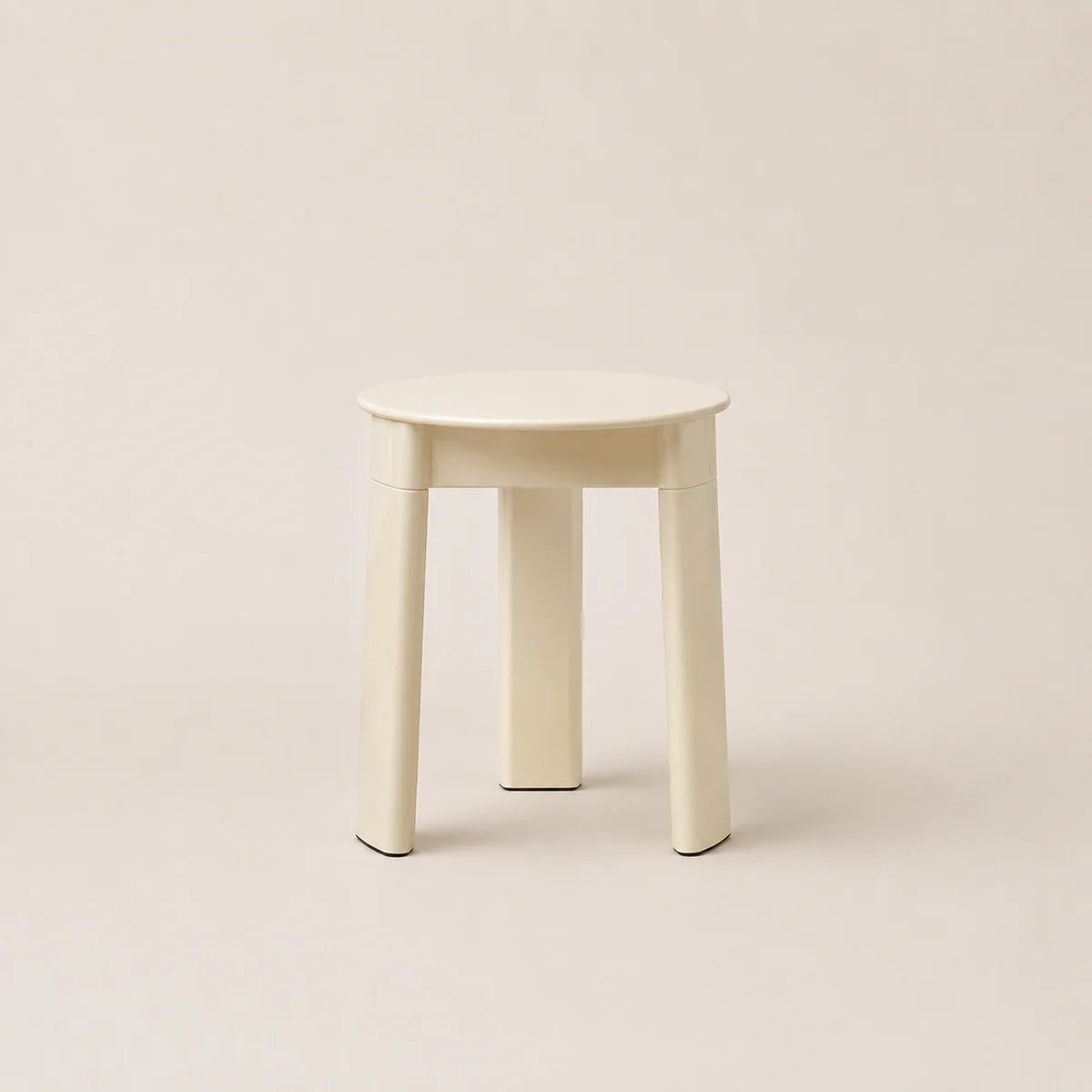 White stool on a beige background